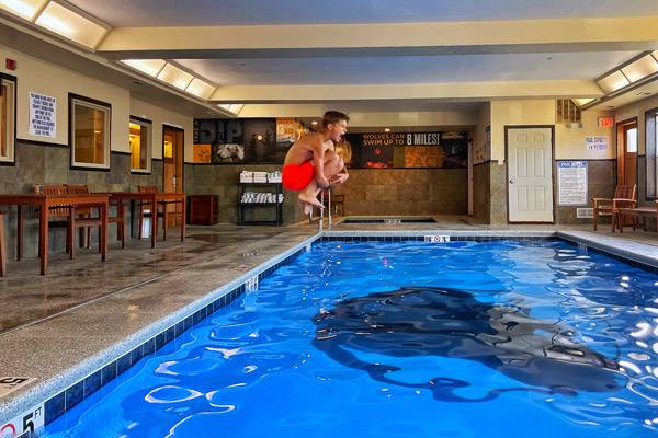 Swimming at the indoor pool at Gray Wolf Inn & Suites